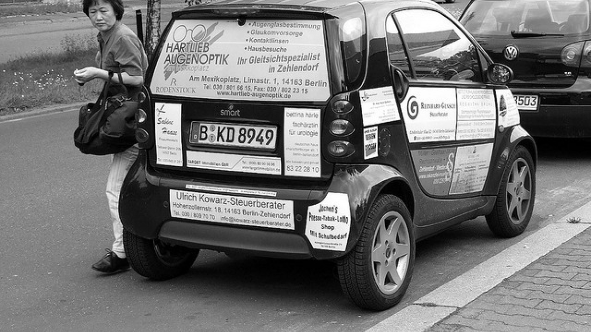 Smart car plastered with ads