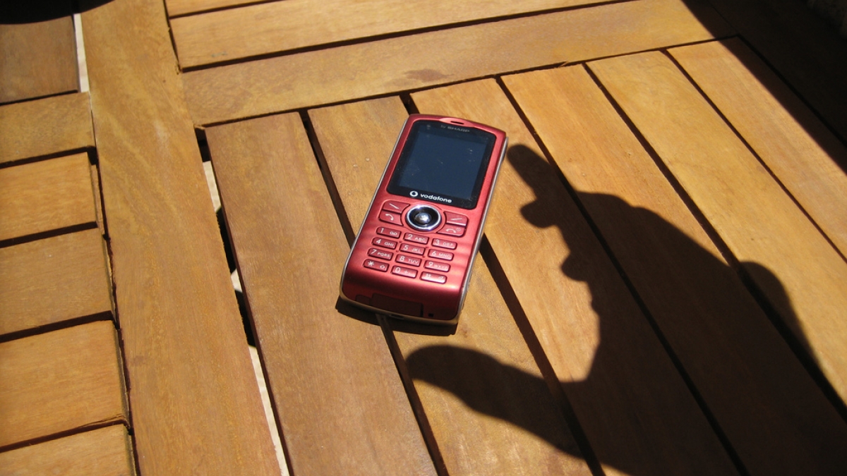 Drupal as an IVR? Just add Twilio. hand shadow answering mobile phone