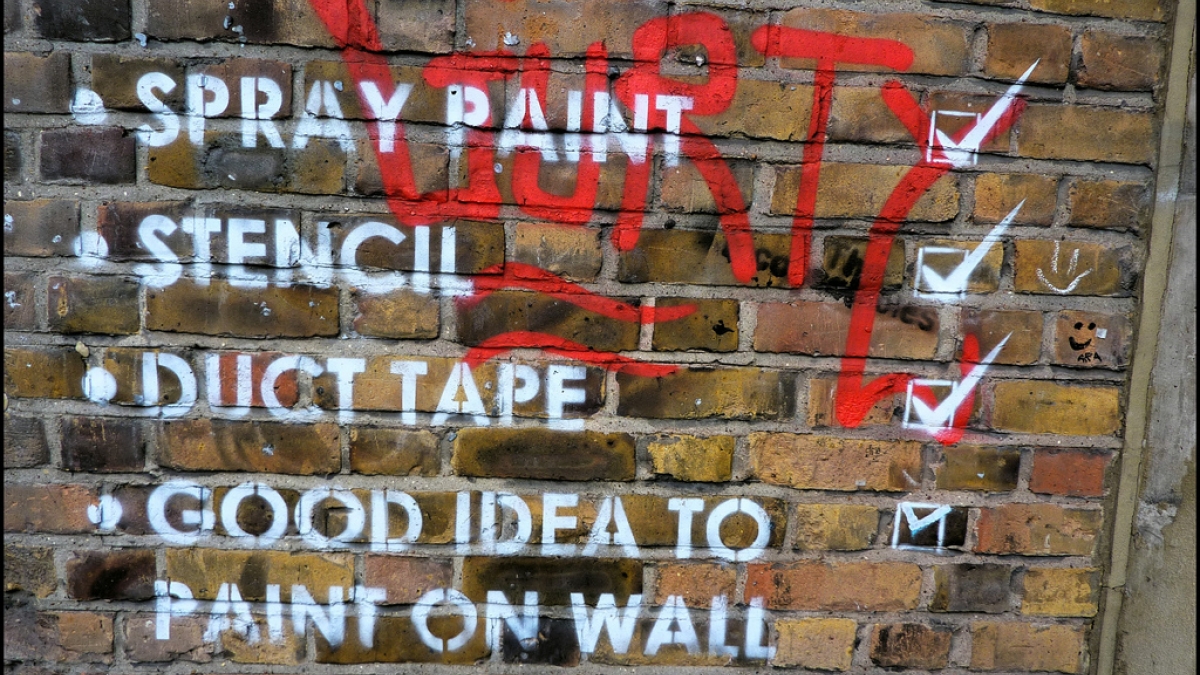 Checklist on brick wall. Spray paing, stencil, duct tape, good idea to paint on wall